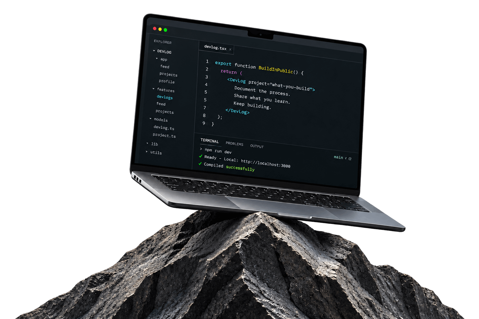 MacBook showing DevLog code on a rock